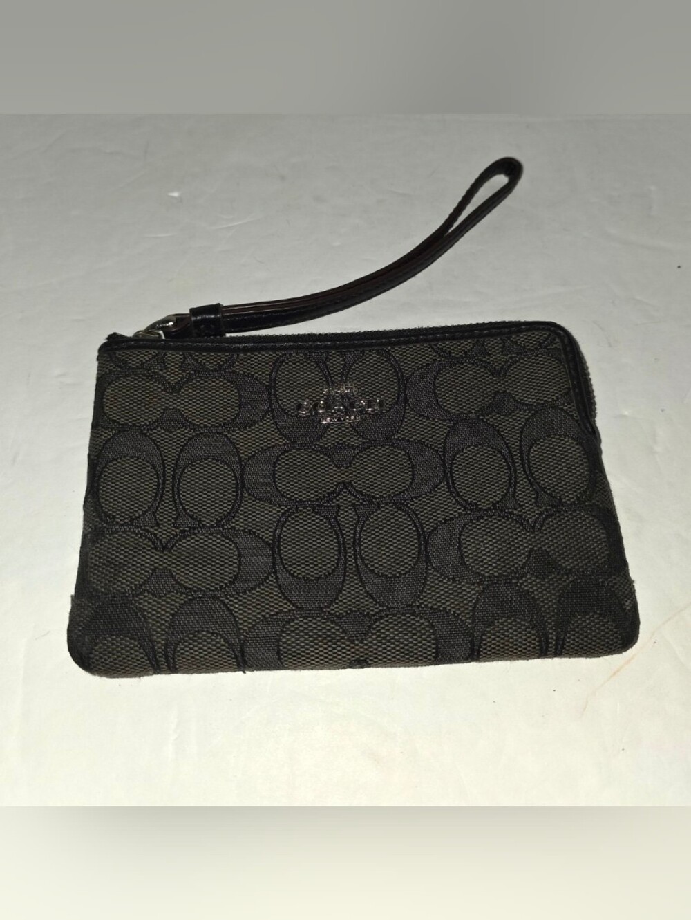 Coach  Zip Wristlet In Signature Canvas Black/Dark Gray Excellent Used Condition